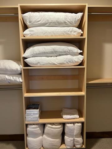 Built-in maple closet shelving system with adjustable shelves