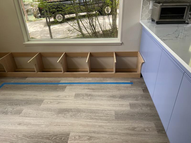 Custom carpentry framing for built-in window bench in progress